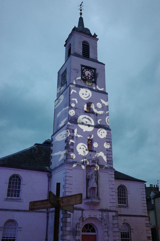 Lanark: Illuminated clock tower at dusk