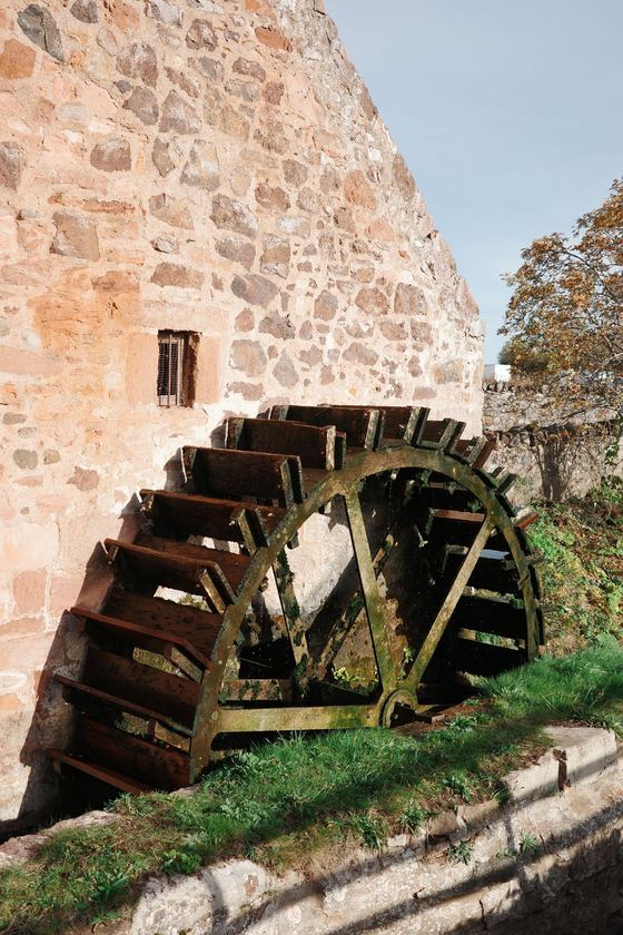 Preston Mill: Waterwheel beside stone mill wall