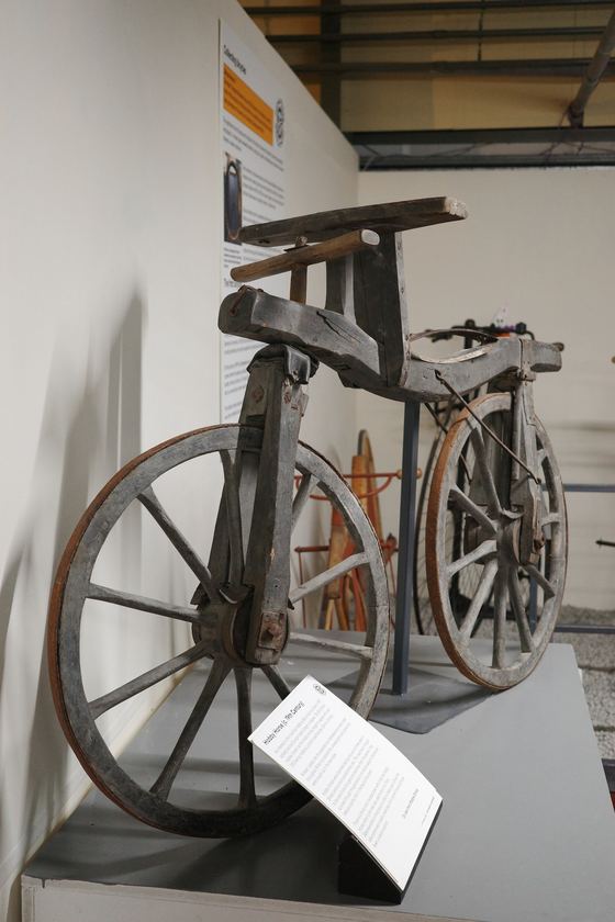 Grampian Transport Museum, Alford: Early bicycle against plain wall