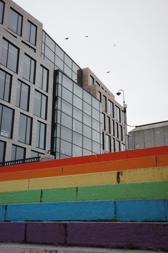 City Centre: Rainbow wall beside modern buildings