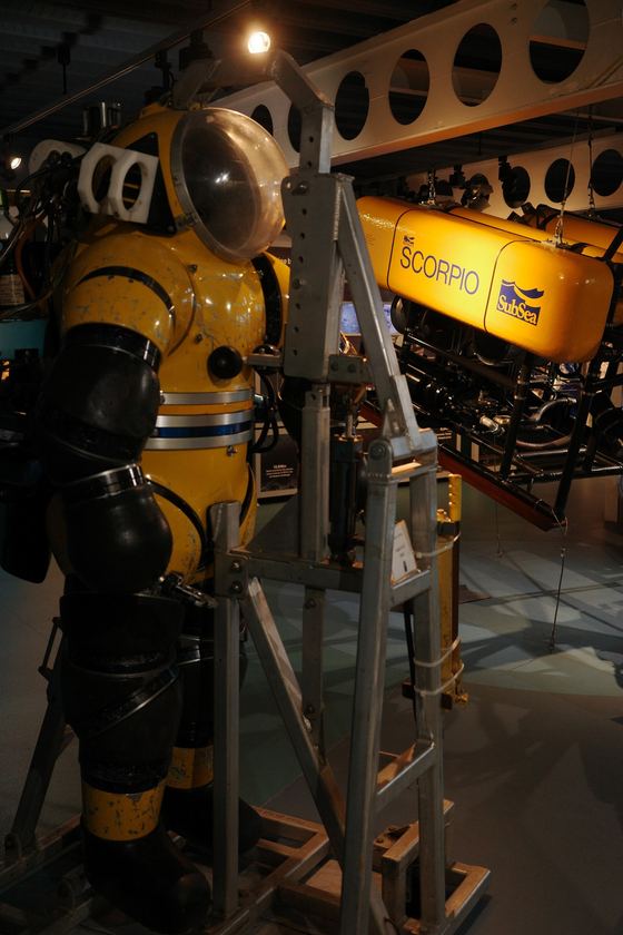 Maritime Museum: Yellow diving equipment in industrial display