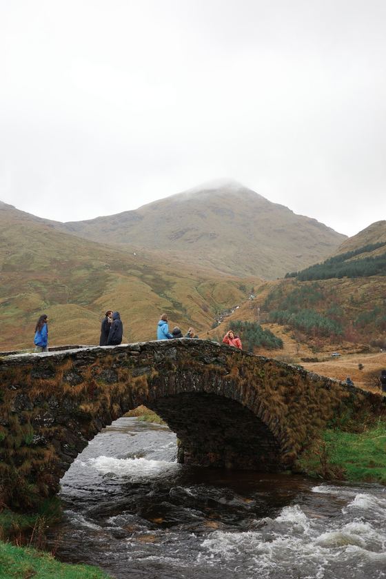 Rest and Be Thankful: Stone bridge spanning a rushing stream