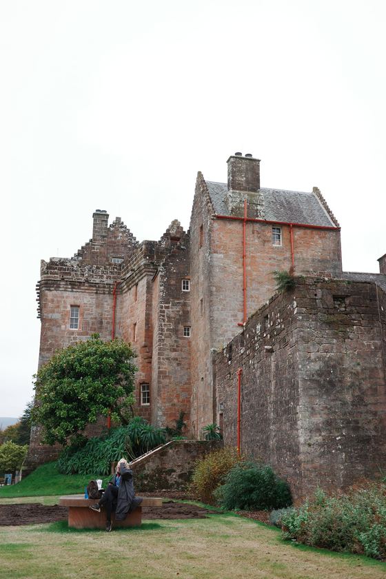 Arran: Stone castle above garden path