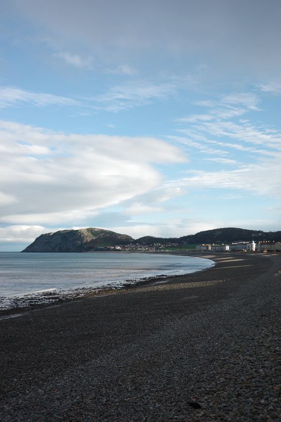 Conwy and Llandudno: Curving shore beneath a blue sky