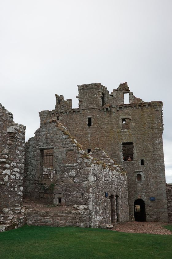 Dunnottar Castle: ruined stone building across lawn