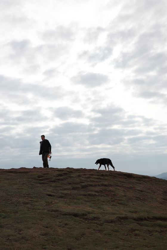 Arthur's Seat: Walker and dog silhouetted on ridge