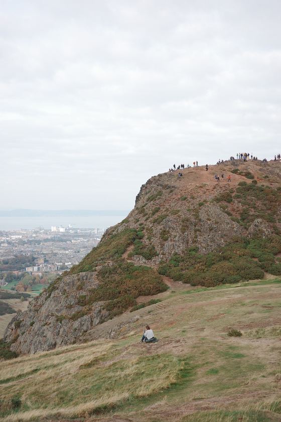 Arthur's Seat: Rocky slope above distant city
