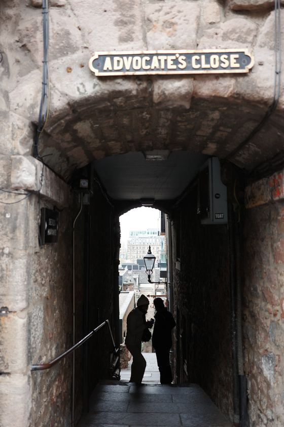 City: Silhouettes framed by stone close