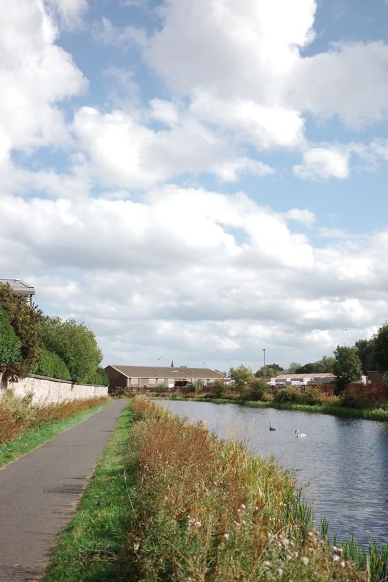 Falkirk: Canal path beneath a cloud filled sky