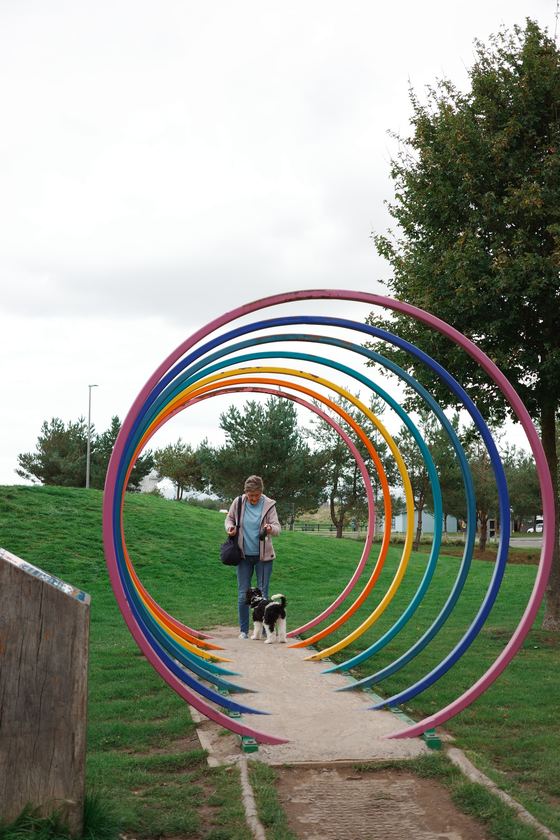 Falkirk: Rainbow arches framing a distant walker