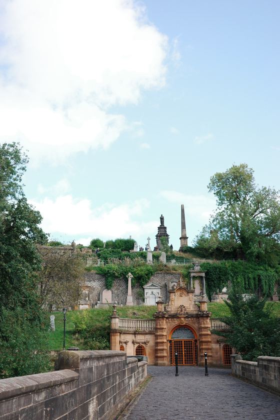 Necropolis: Path leading toward stone mausoleum