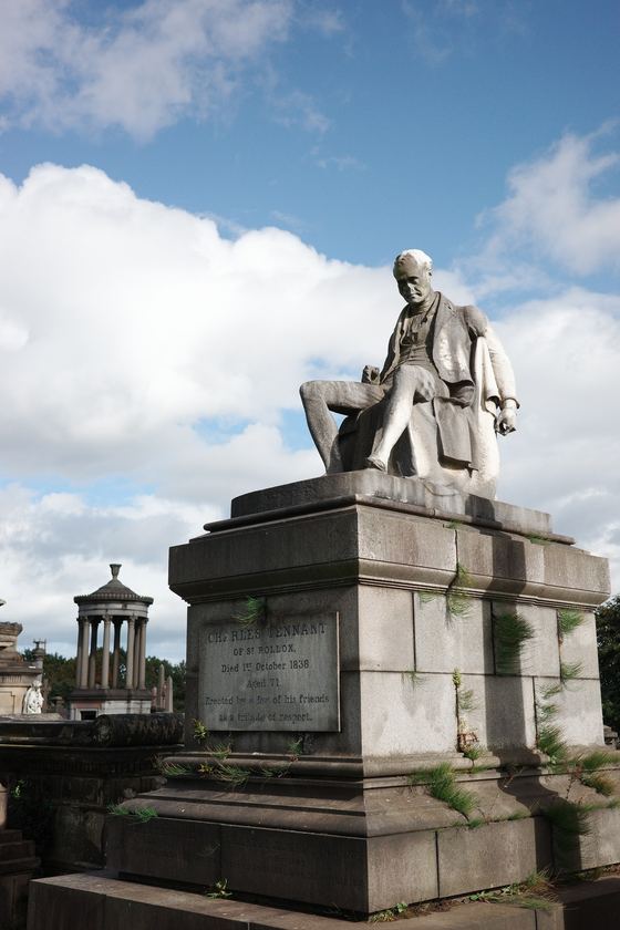 Necropolis: Seated statue above cemetery skyline