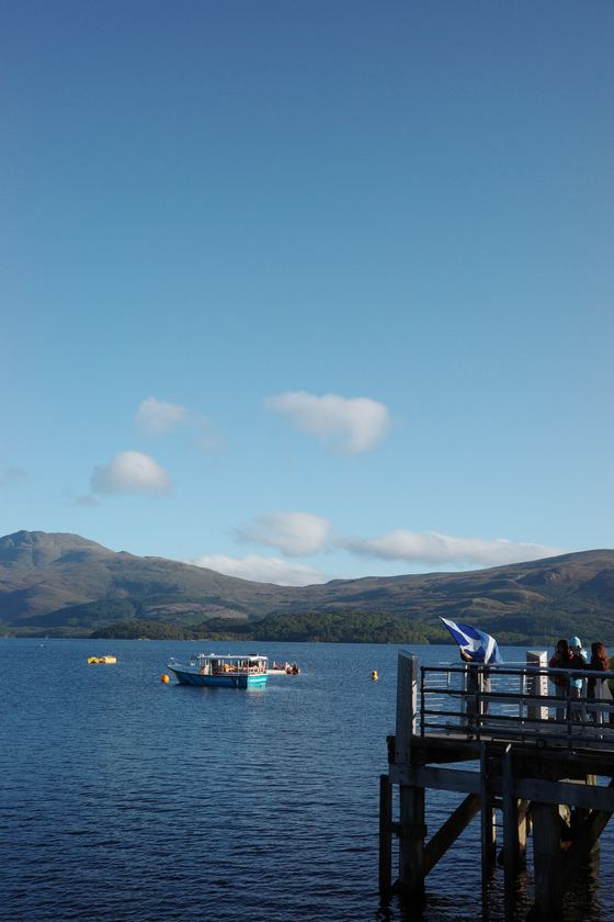 Luss: Pier overlooking boats and hills