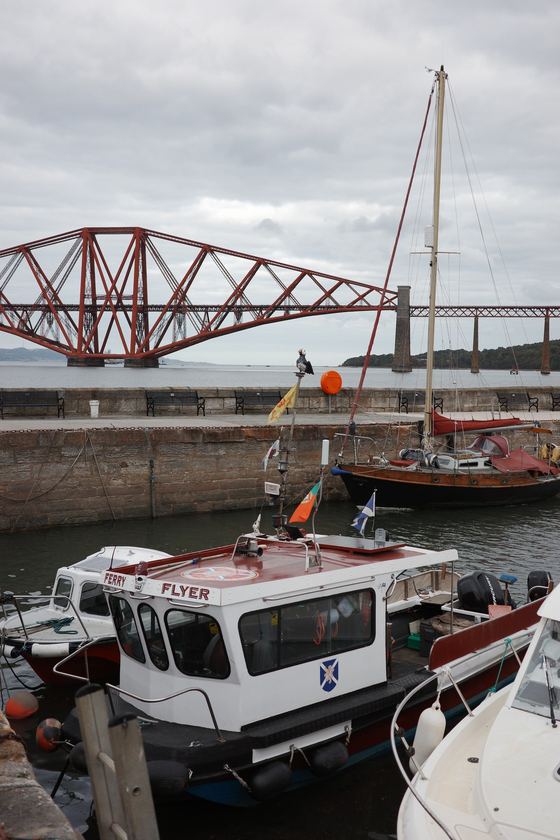 Queensferry: Harbor boats beneath red bridge