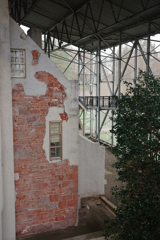 Hill House: Weathered house beneath protective structure