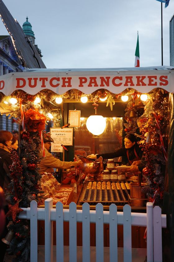 Belfast: Glowing Dutch pancake market stall