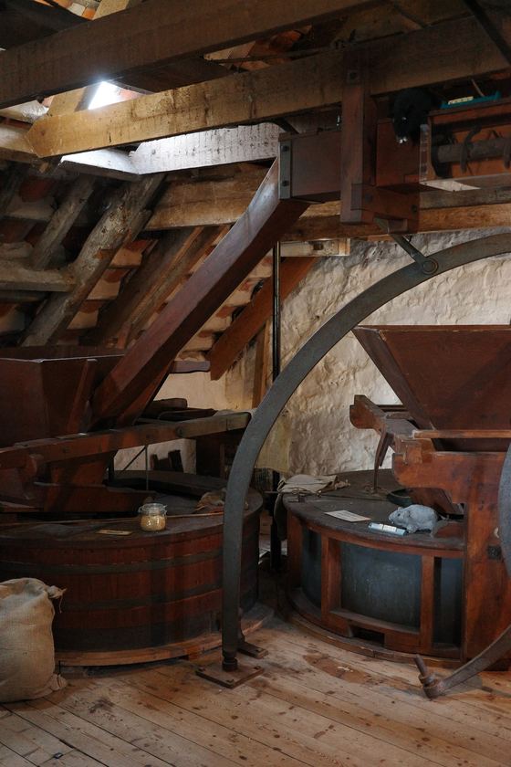 Preston Mill: Large wheel inside timber mill