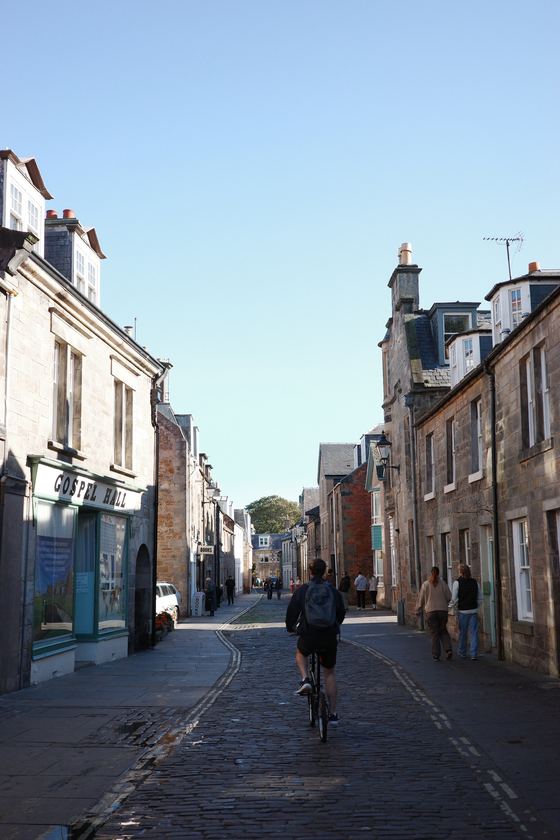 City: Cyclist on a narrow stone street