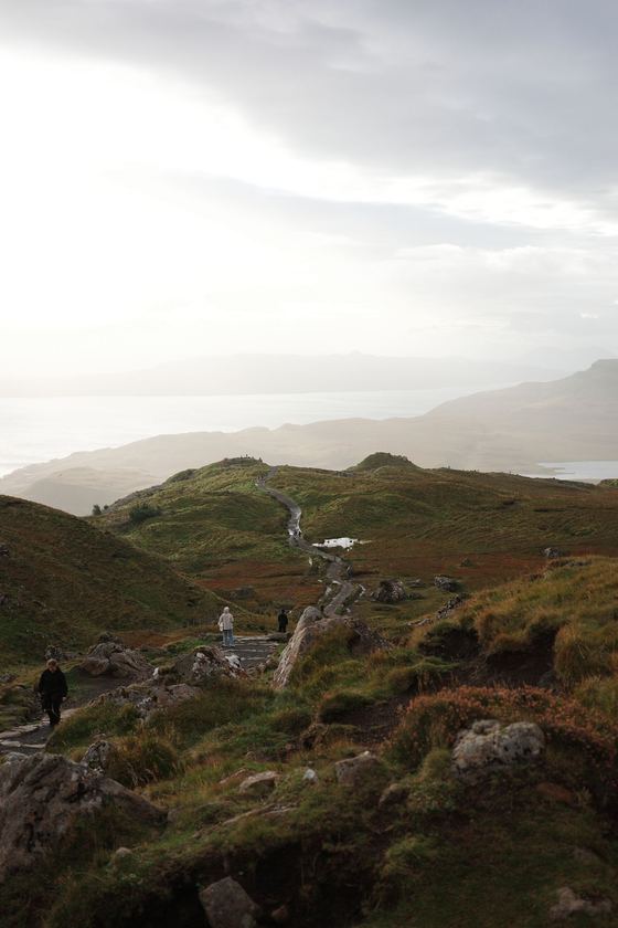 Storr: Sunlit trail across rolling moorland