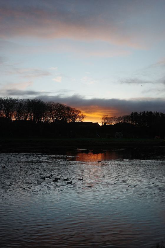 Wick: Sunset reflected across calm river
