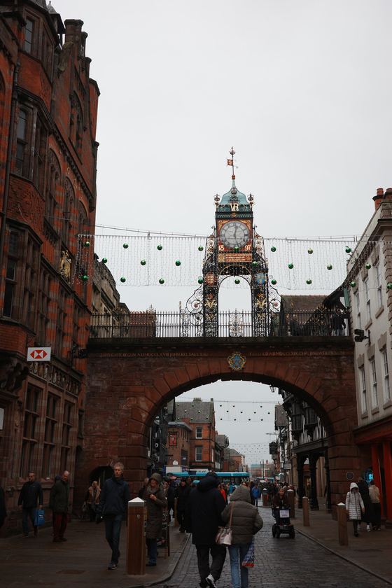 Chester: Clock tower framed by street arch