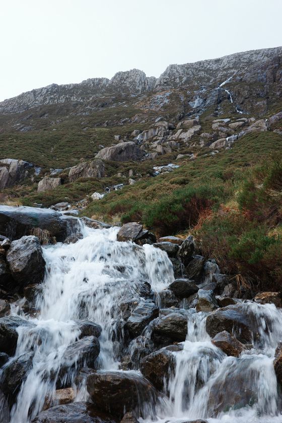 Snowdonia and Llanfairpwll: Waterfall tumbling over dark rocks